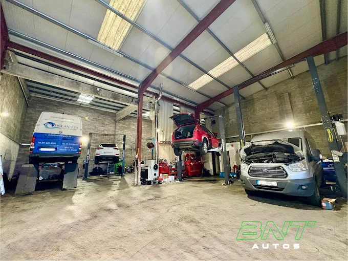 Cars and vans on lifts in the BNT Autos service bays in Baldoyle